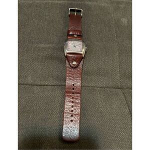 Fossil woman’s JR- 8480 silver cuff brown leather band analog quartz watch